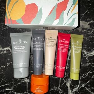 Origins Skincare Collection with Red, Green, and Orange Accents